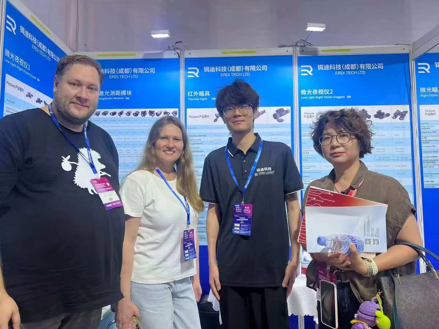 ERDI TECH LTD team meeting visitors at an optoelectronics exhibition