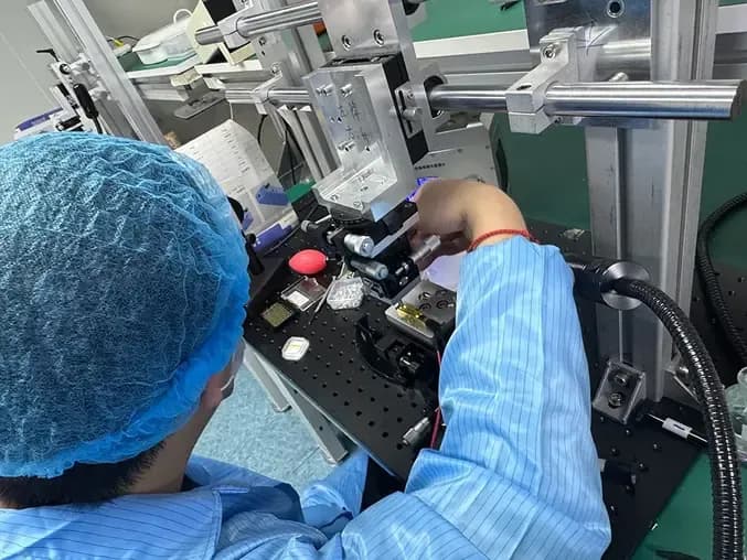 ERDI technician performing optical alignment and module verification