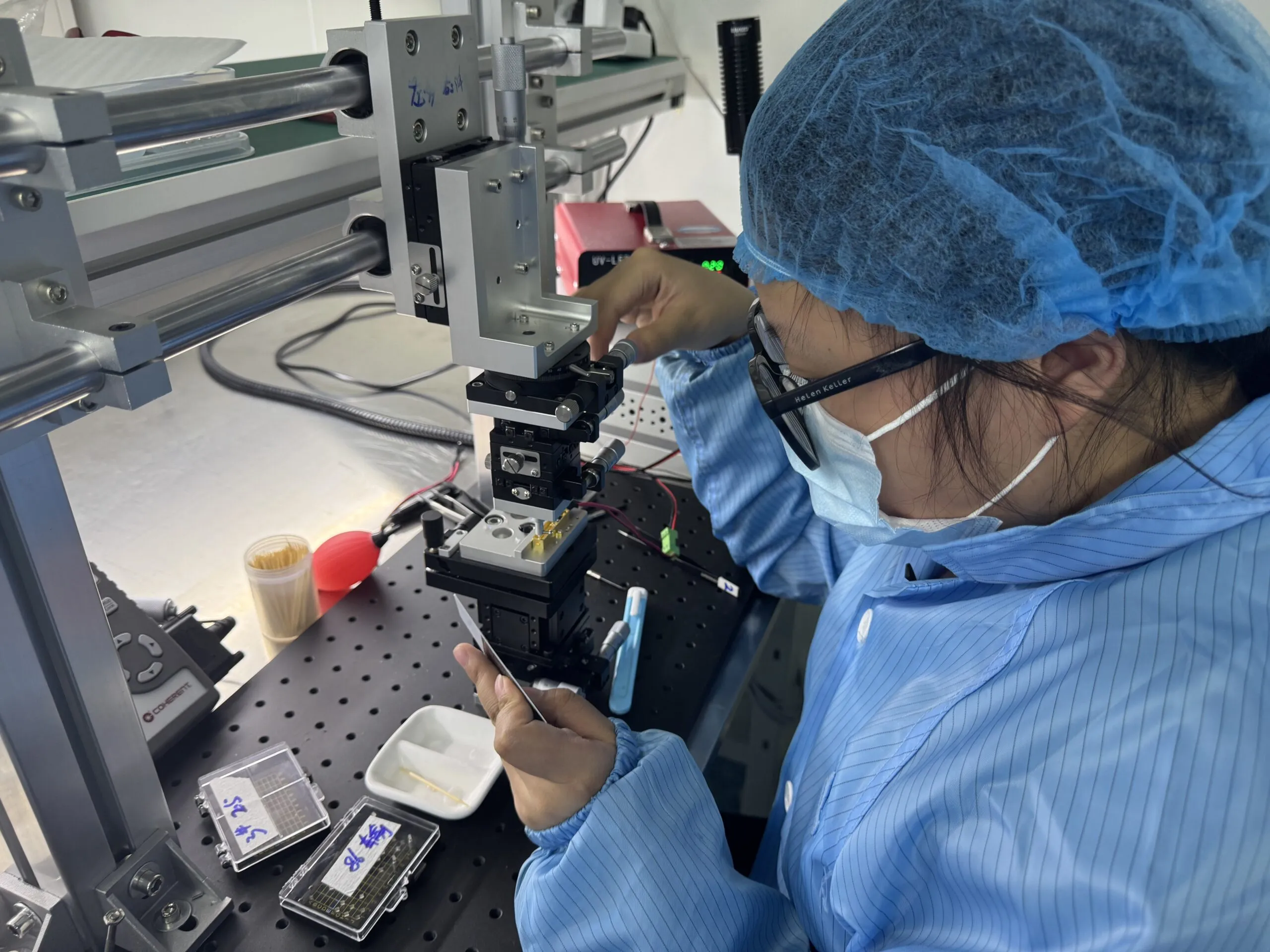 ERDI technician aligning an optoelectronic assembly on an optical workstation